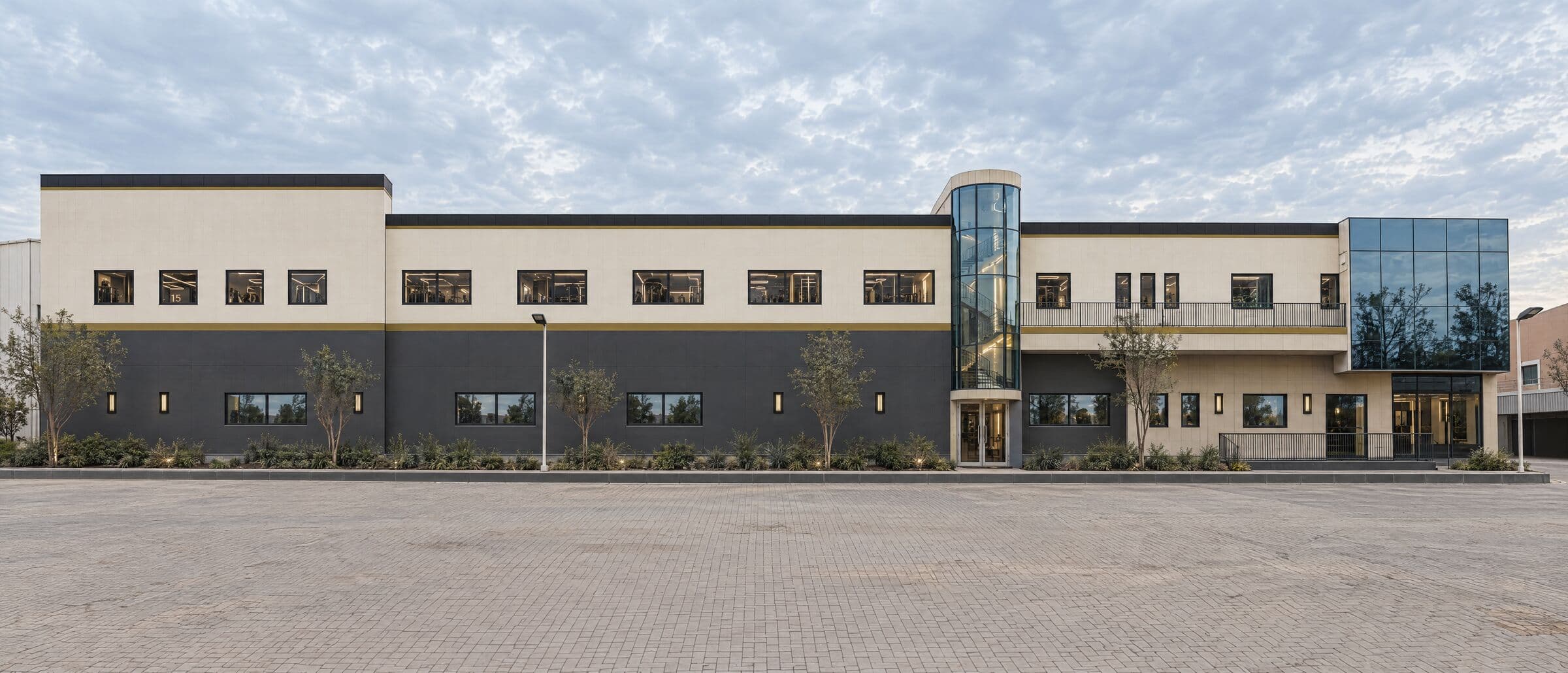 Two-storey gym building with a glazed stair tower at Dubai Creative Park